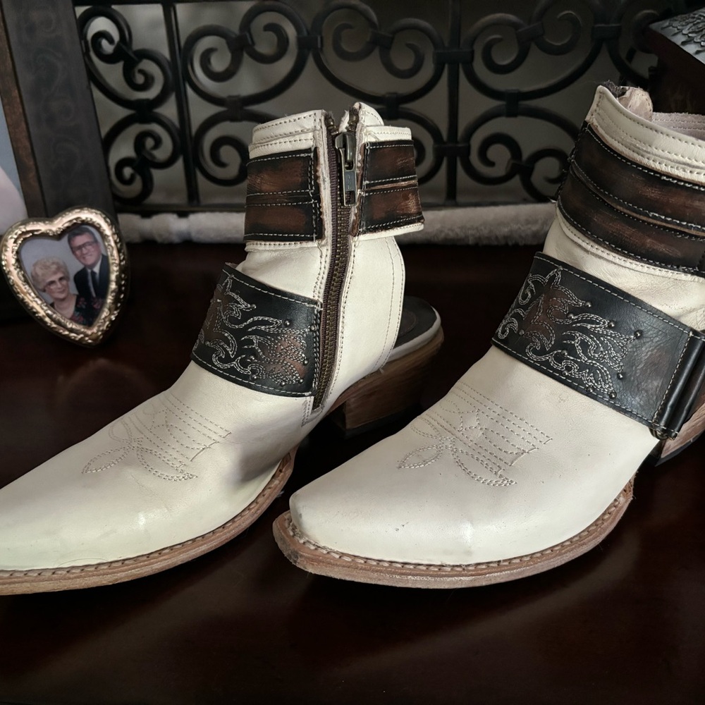 Freebird, no heel boots.  So sharp!  Go with black, brown or cream outfits.